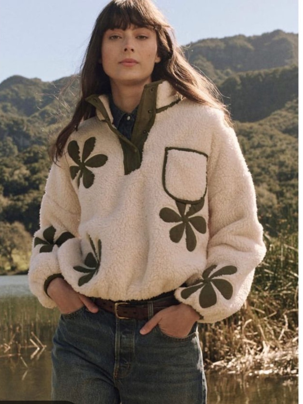 THE GREAT. Cream Sherpa Pullover Jacket with Olive Floral Appliqués